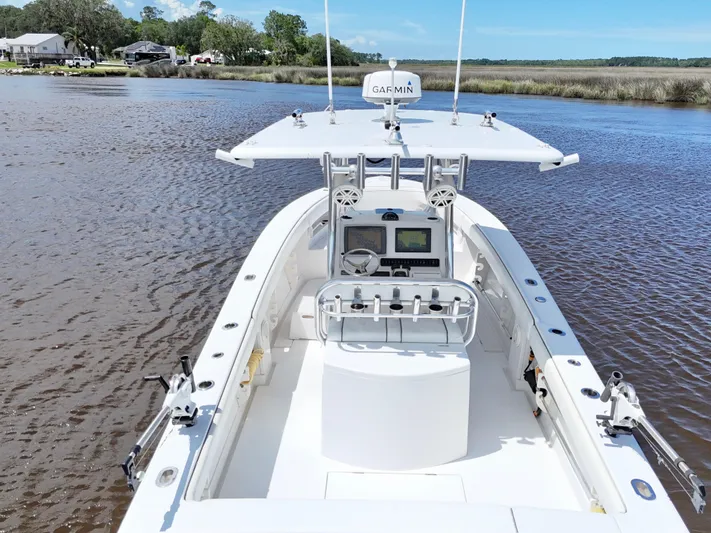  Yacht Photos Pics 2013 Jupiter 30 FS boat on calm water, featuring advanced Garmin navigation system.
