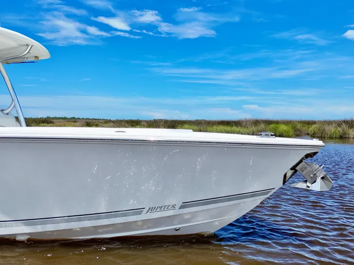  Yacht Photos Pics 2013 Jupiter 30 FS boat on calm water under a clear blue sky.