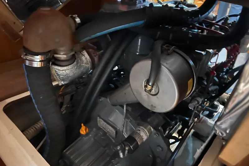 Thumper Yacht Photos Pics Engine compartment of a 2001 Tartan 3700 Sloop sailboat, showcasing mechanical components.