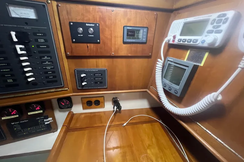 Thumper Yacht Photos Pics Control panel of a 2001 Tartan 3700 Sloop with navigation and communication equipment.