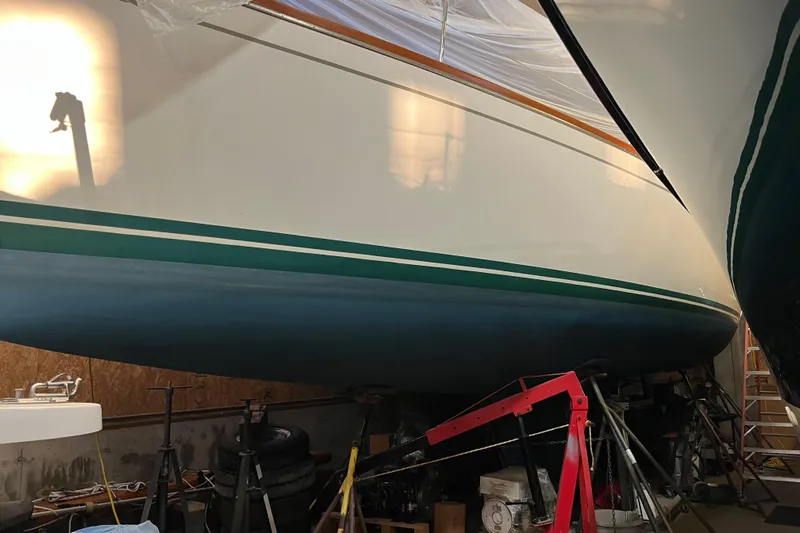 Thumper Yacht Photos Pics 2001 Tartan 3700 Sloop in storage, showcasing sleek hull design and vibrant colors.