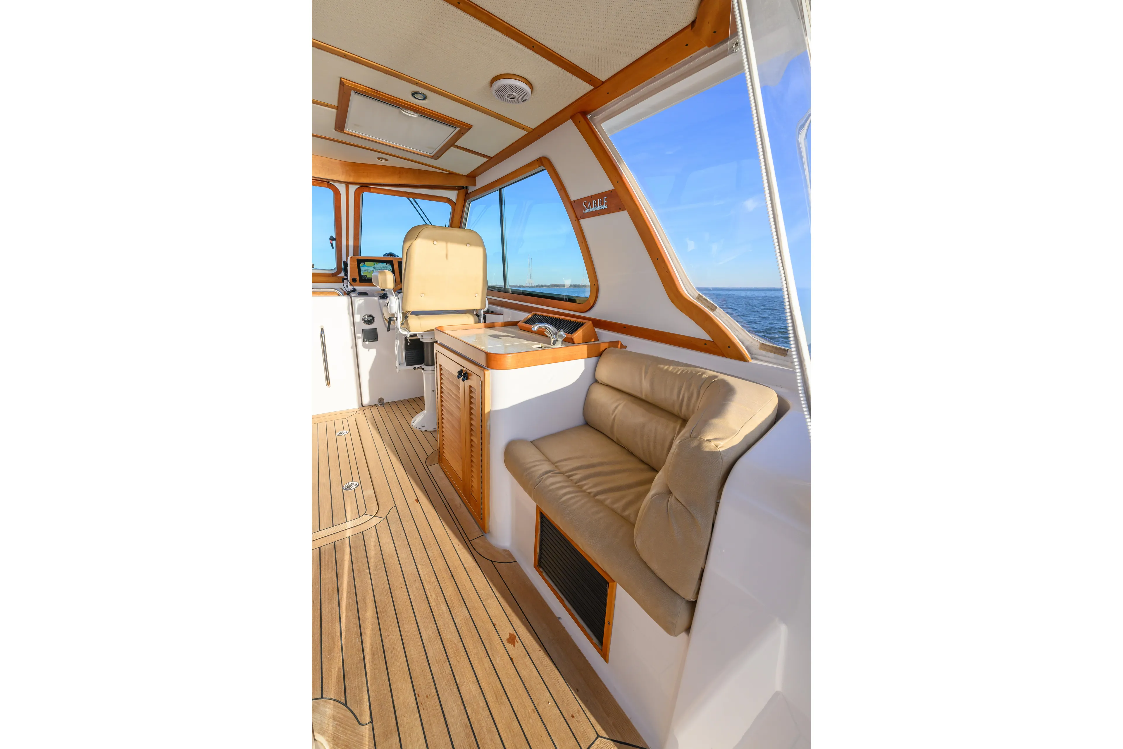 More Mojo Yacht Photos Pics Interior of 2009 Sabre 42 Hard Top Express yacht with seating and ocean view.