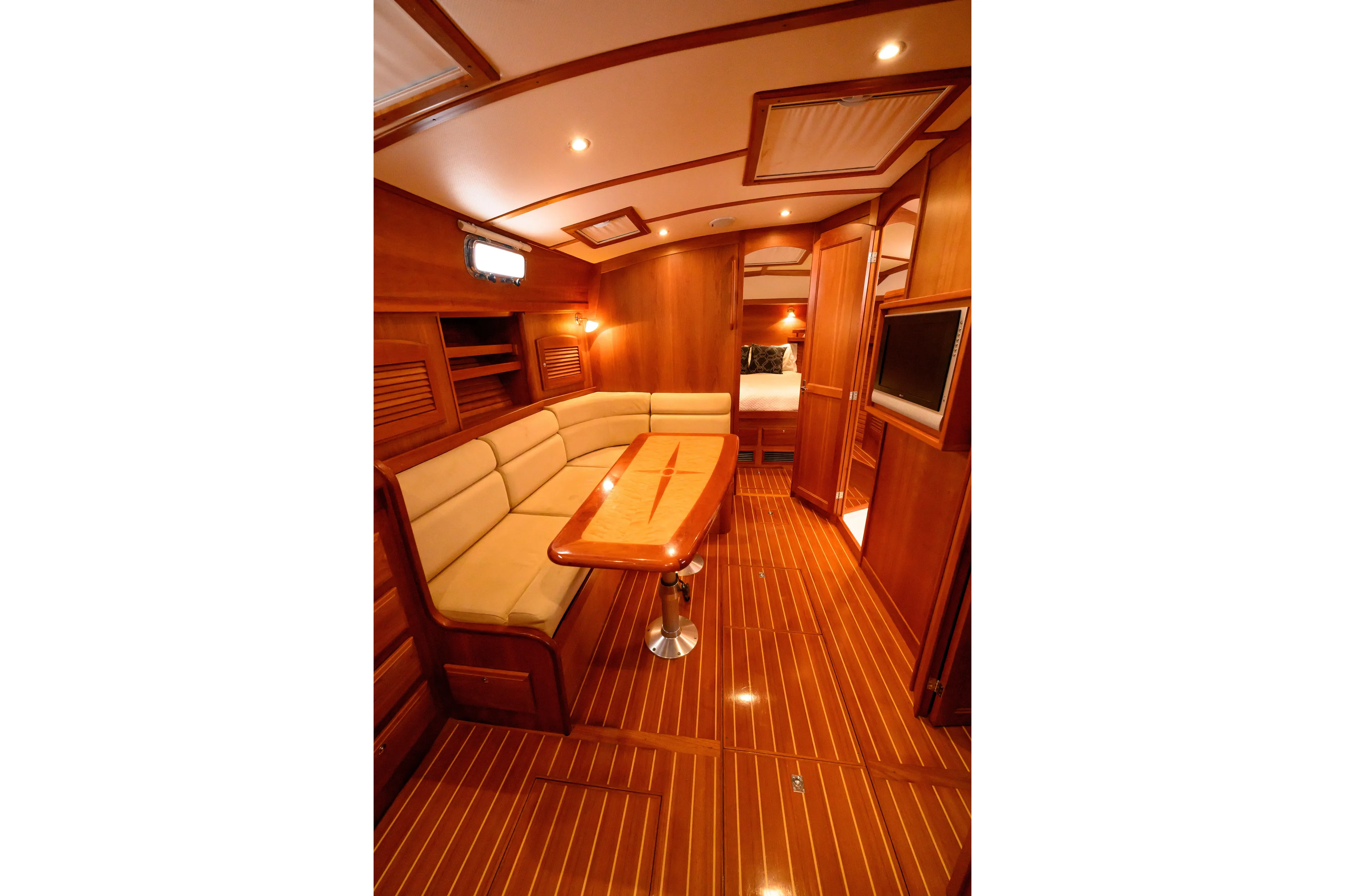 More Mojo Yacht Photos Pics Luxurious interior of 2009 Sabre 42 Hard Top Express yacht with wood finish and seating area.