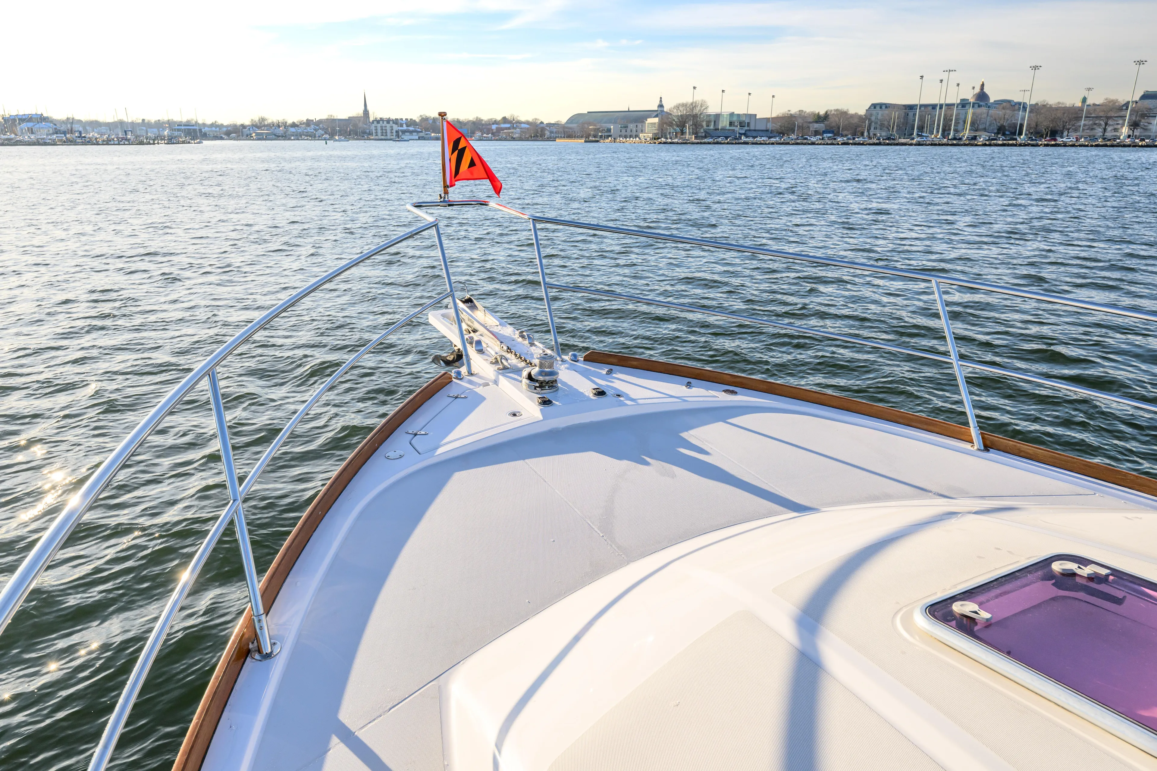 More Mojo Yacht Photos Pics Bow view of 2009 Sabre 42 Hard Top Express yacht on calm waters.