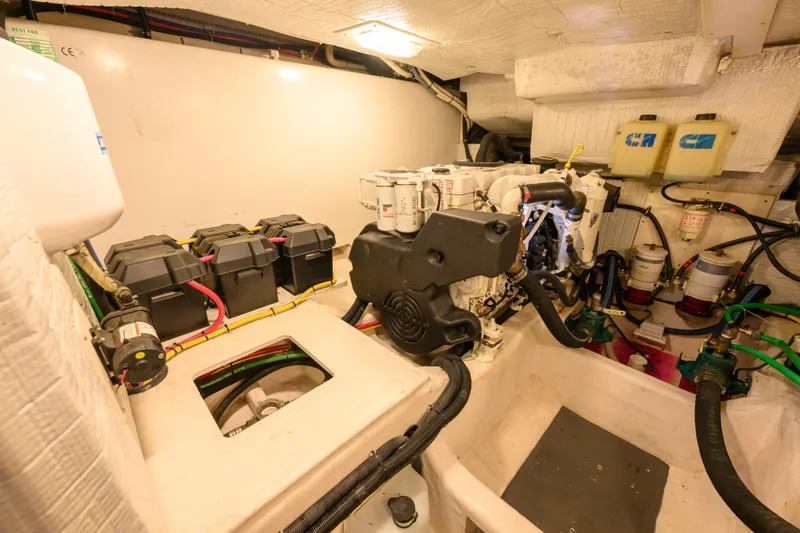 More Mojo Yacht Photos Pics Engine room of 2009 Sabre 42 Hard Top Express, showcasing batteries and mechanical components.