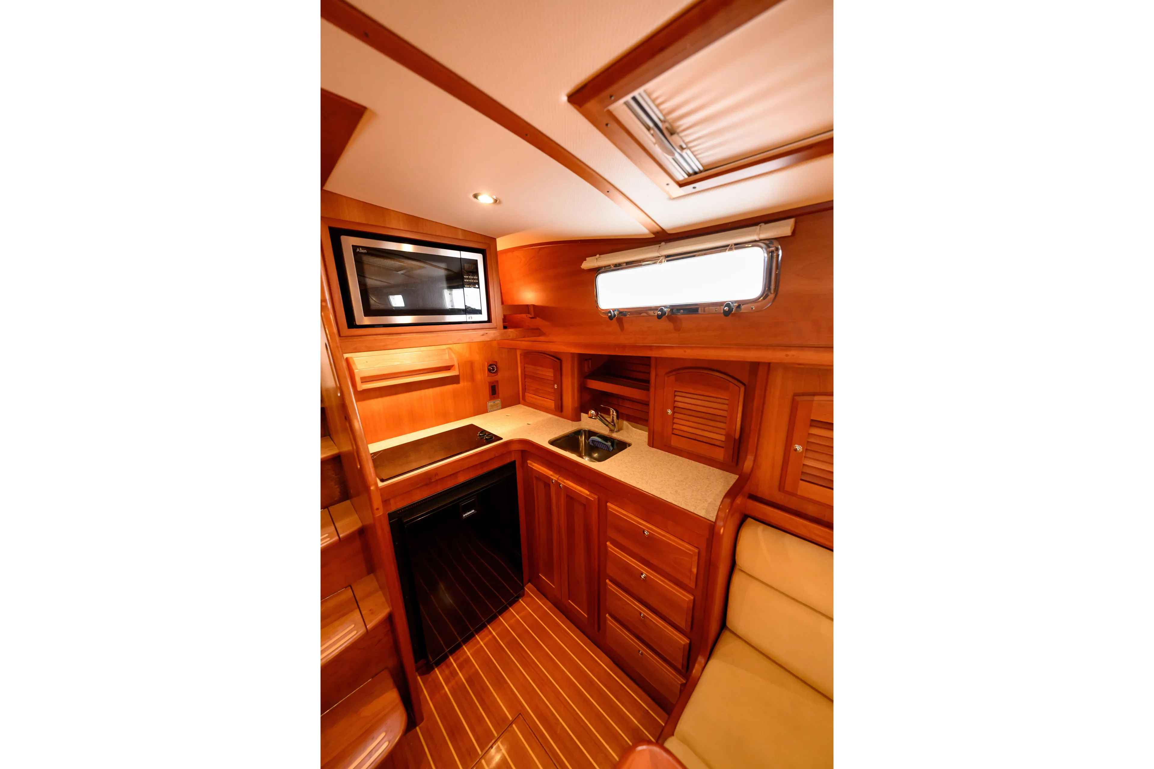 More Mojo Yacht Photos Pics Luxurious wooden interior of 2009 Sabre 42 Hard Top Express yacht kitchen area.