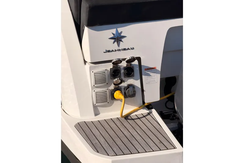  Yacht Photos Pics 2020 Jeanneau NC 895 boat stern with power connections and logo.