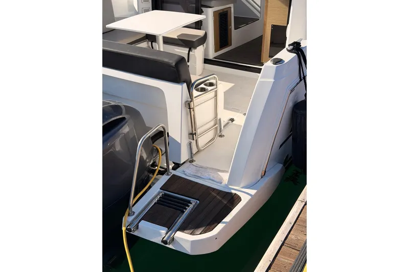  Yacht Photos Pics 2020 Jeanneau NC 895 boat stern with swim platform and seating area.