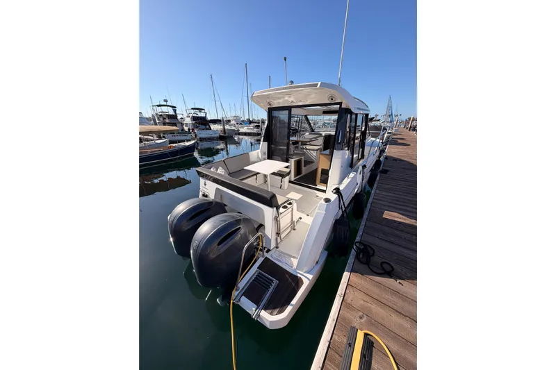  Yacht Photos Pics 2020 Jeanneau NC 895 boat docked at marina with dual outboard engines.