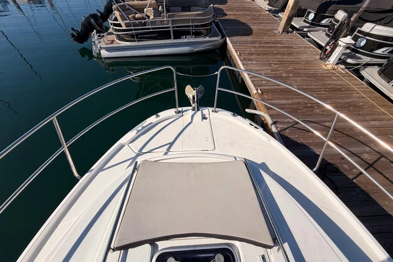  Yacht Photos Pics 2020 Jeanneau NC 895 boat docked, featuring bow deck and railing.