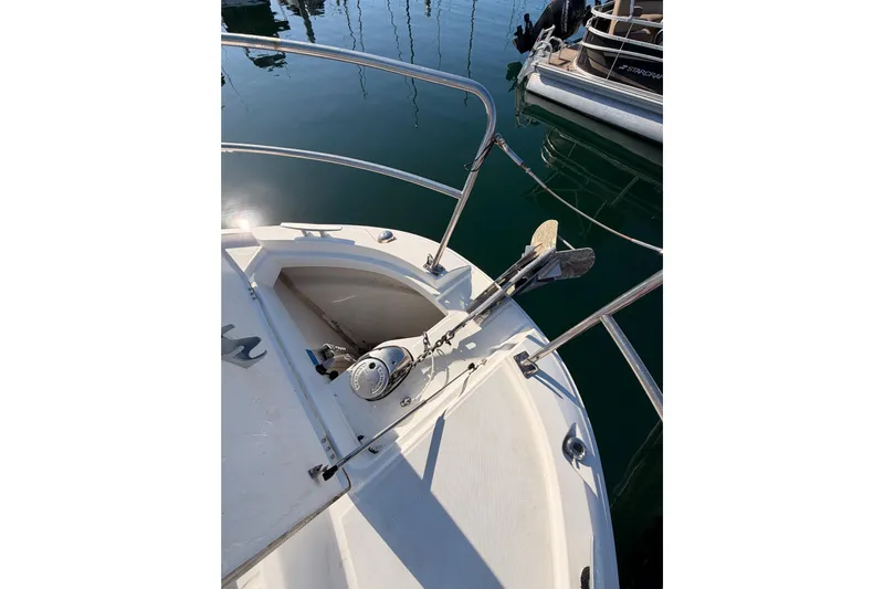  Yacht Photos Pics Bow of 2020 Jeanneau NC 895 boat with anchor and railing in marina.