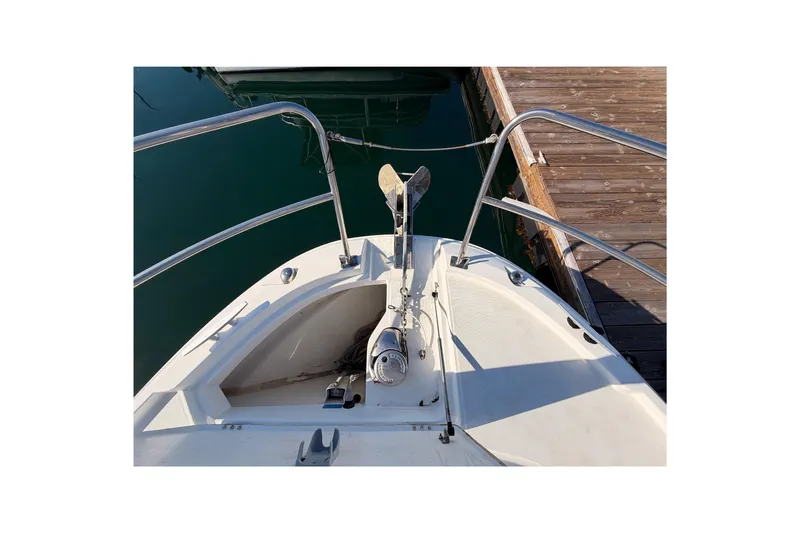  Yacht Photos Pics Bow view of 2020 Jeanneau NC 895 boat docked at a marina.