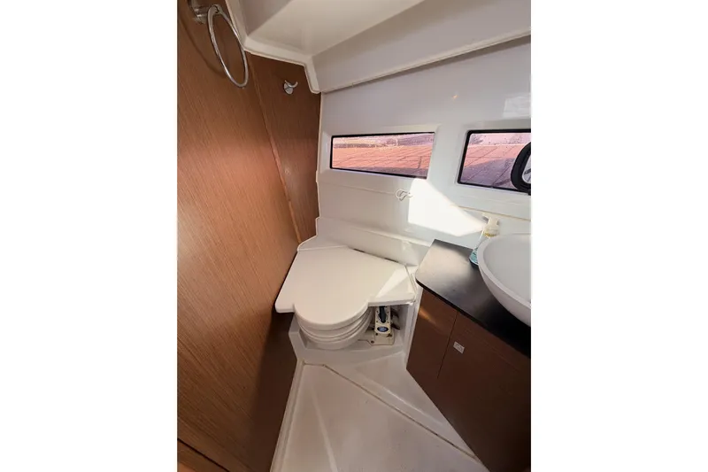  Yacht Photos Pics Interior of 2020 Jeanneau NC 895 boat bathroom with toilet and sink.