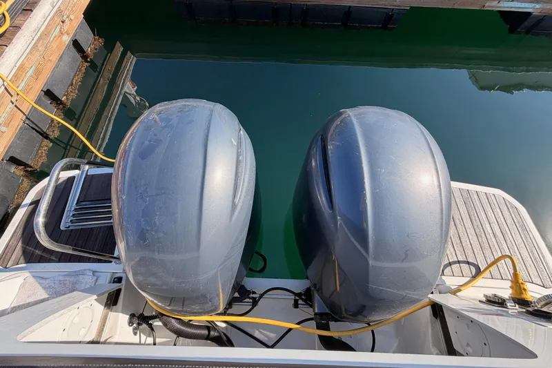  Yacht Photos Pics 2020 Jeanneau NC 895 boat with dual outboard motors at dock.