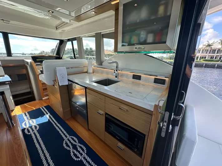 Aeronautical Yacht Photos Pics Luxurious interior of 2022 Tiara Yachts C39 Coupe with modern kitchen and scenic views.