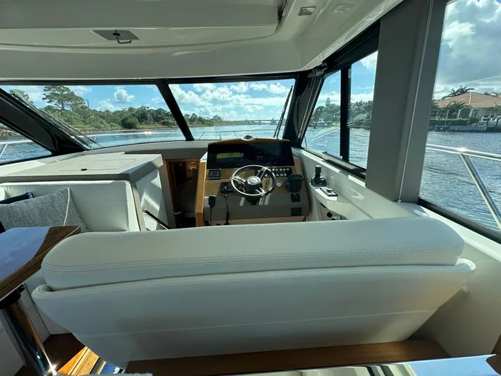 Aeronautical Yacht Photos Pics Interior view of 2022 Tiara Yachts C39 Coupe helm with panoramic windows.