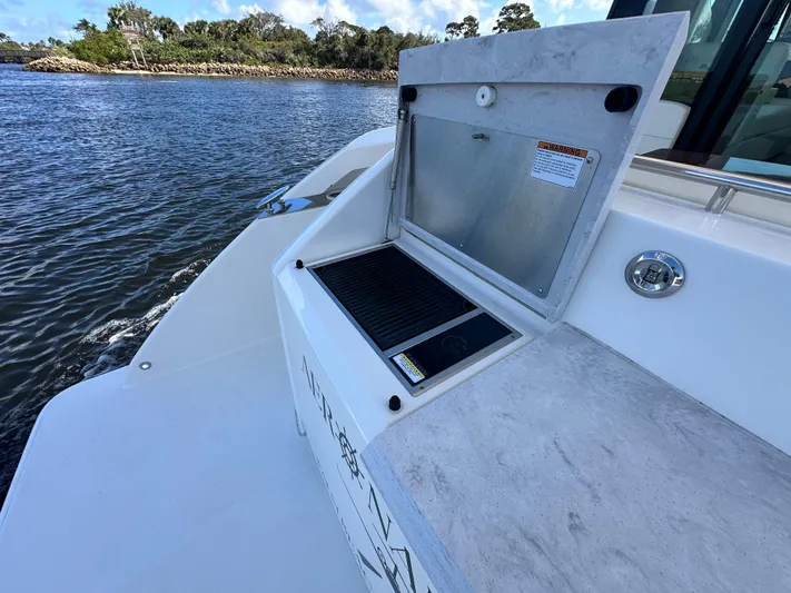 Aeronautical Yacht Photos Pics Tiara Yachts 2022 C39 Coupe outdoor grill on deck by the water.