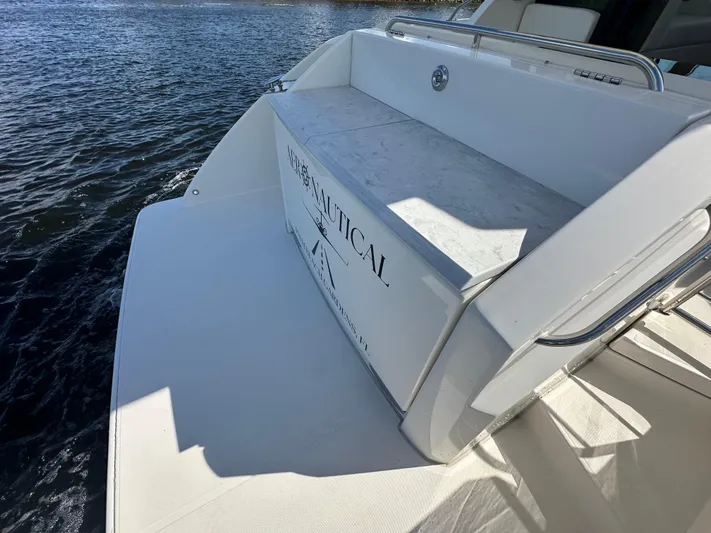 Aeronautical Yacht Photos Pics 2022 Tiara Yachts C39 Coupe, rear deck view, on water.