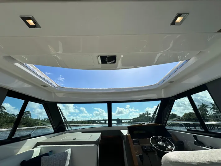 Aeronautical Yacht Photos Pics Interior view of 2022 Tiara Yachts C39 Coupe with panoramic windows and skylight.