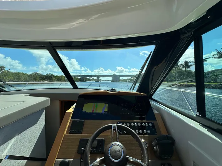 Aeronautical Yacht Photos Pics Interior view of 2022 Tiara Yachts C39 Coupe helm with scenic waterway.
