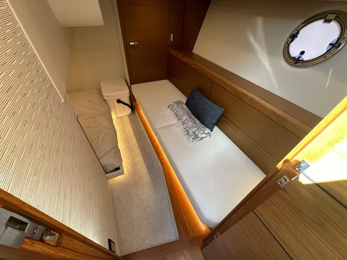 Aeronautical Yacht Photos Pics 2022 Tiara Yachts C39 Coupe cabin interior with modern design and cozy bedding.