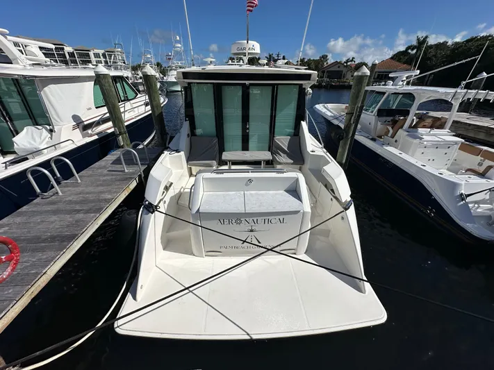 Aeronautical Yacht Photos Pics 2022 Tiara Yachts C39 Coupe docked at marina, rear view.