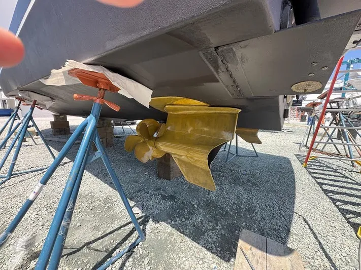 Aeronautical Yacht Photos Pics 2022 Tiara Yachts C39 Coupe under maintenance, showcasing propeller and hull details.