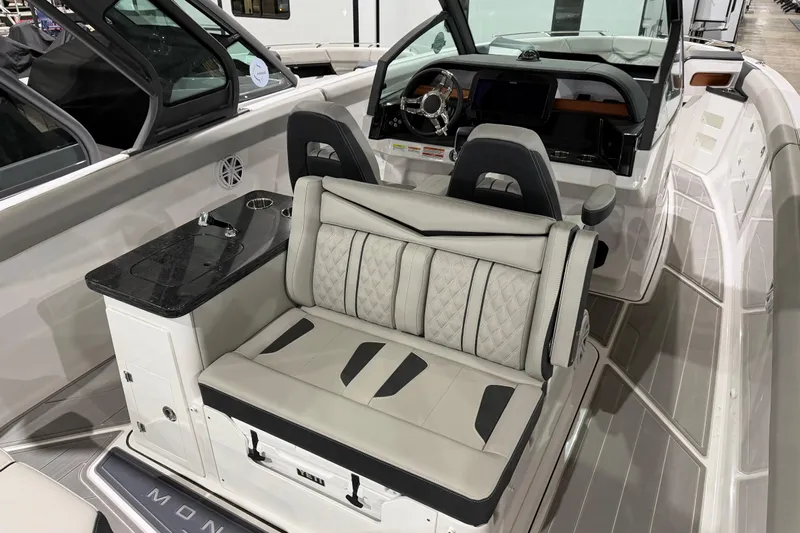  Yacht Photos Pics 2026 Monterey Elite 30 OB boat interior with luxurious seating and modern dashboard.