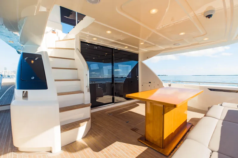 Sami Kay III Yacht Photos Pics 2017 Ferretti Yachts 750, luxurious deck with seating, table, and staircase.