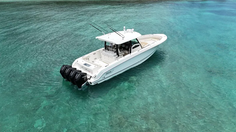  Yacht Photos Pics 2020 Boston Whaler 380 Outrage boat on clear turquoise water.