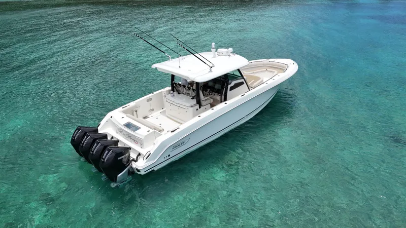  Yacht Photos Pics 2020 Boston Whaler 380 Outrage boat on clear turquoise water.