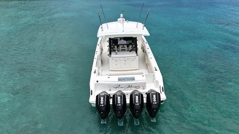  Yacht Photos Pics Boston Whaler 380 Outrage 2020 with quad engines on clear blue water.