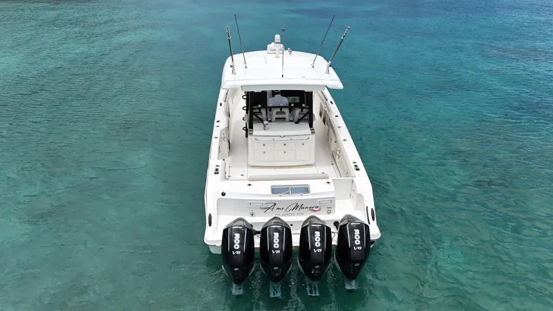  Yacht Photos Pics 2020 Boston Whaler 380 Outrage boat with four engines on clear blue water.