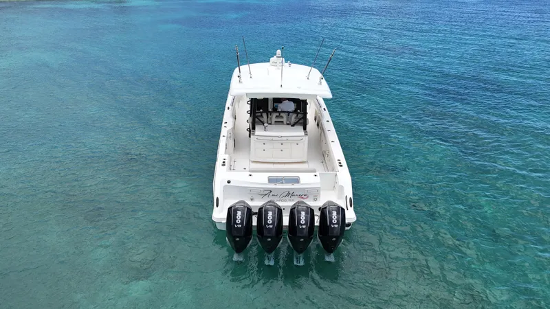  Yacht Photos Pics 2020 Boston Whaler 380 Outrage on clear blue water, rear view with four engines.