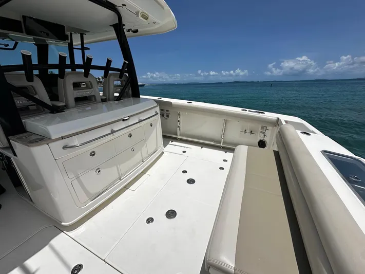  Yacht Photos Pics Boston Whaler 380 Outrage 2020 boat interior with seating, ocean view, and clear sky.