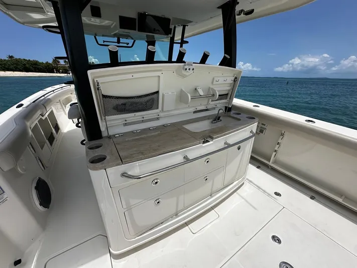  Yacht Photos Pics 2020 Boston Whaler 380 Outrage boat interior with sleek design and ocean view.