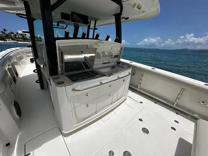  Yacht Photos Pics 2020 Boston Whaler 380 Outrage boat interior with open storage, near ocean.