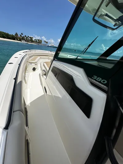  Yacht Photos Pics Boston Whaler 380 Outrage 2020 cruising on clear blue waters, sunny day.