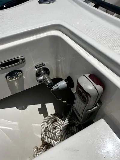  Yacht Photos Pics Boston Whaler 380 Outrage 2020 boat compartment with rope and equipment.