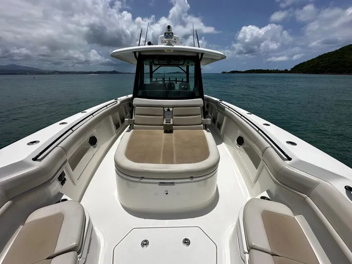  Yacht Photos Pics 2020 Boston Whaler 380 Outrage boat on calm water under cloudy sky.