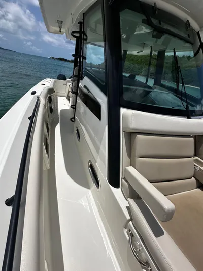  Yacht Photos Pics 2020 Boston Whaler 380 Outrage boat deck with seating, on a sunny day.