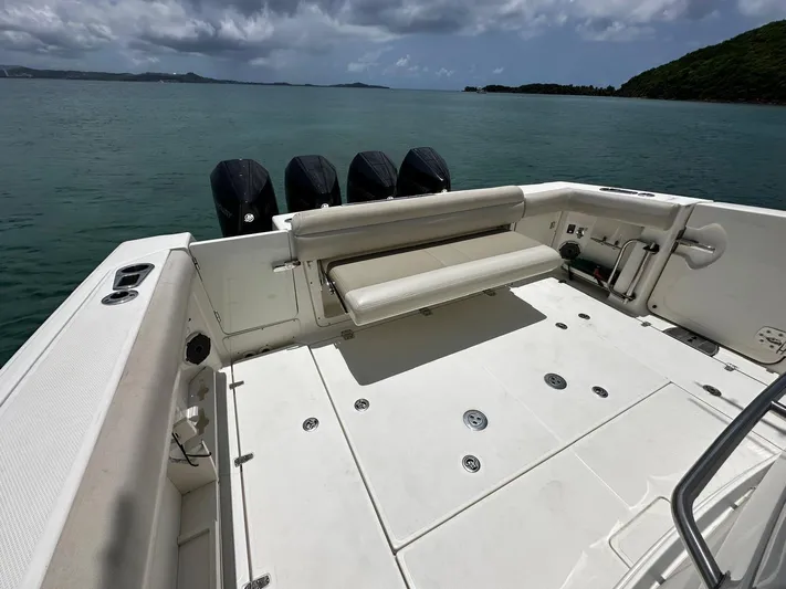  Yacht Photos Pics 2020 Boston Whaler 380 Outrage boat deck with seating, ocean view.