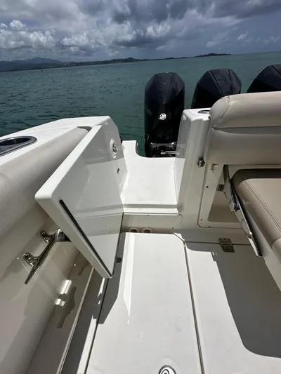  Yacht Photos Pics 2020 Boston Whaler 380 Outrage boat with open side door, ocean view.