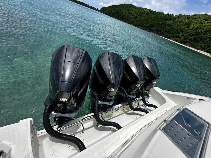  Yacht Photos Pics Four powerful outboard motors on a 2020 Boston Whaler 380 Outrage in clear waters.