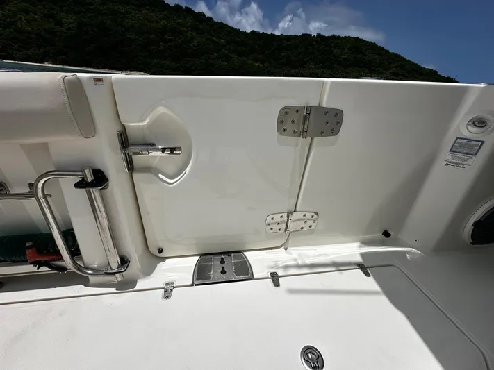  Yacht Photos Pics 2020 Boston Whaler 380 Outrage boat deck with hatch and stainless steel fittings.