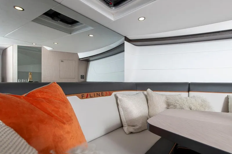 '23 Fairline Fline 33 Ob Yacht Photos Pics 2023 Fairline F//Line 33 Outboard interior with modern seating and plush cushions.