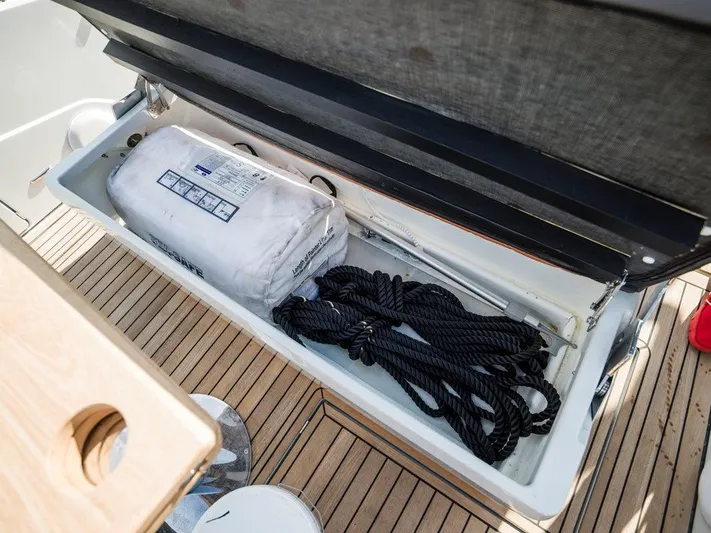 '23 Fairline Fline 33 Ob Yacht Photos Pics Storage compartment on 2023 Fairline F//Line 33 Outboard with ropes and equipment.