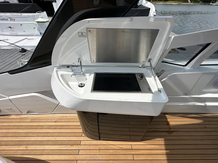 '23 Fairline Fline 33 Ob Yacht Photos Pics Fairline F//Line 33 Outboard 2023 yacht with open outdoor kitchenette on teak deck.