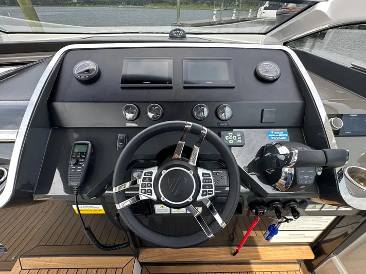 '23 Fairline Fline 33 Ob Yacht Photos Pics 2023 Fairline F//Line 33 Outboard helm with modern controls and navigation equipment.