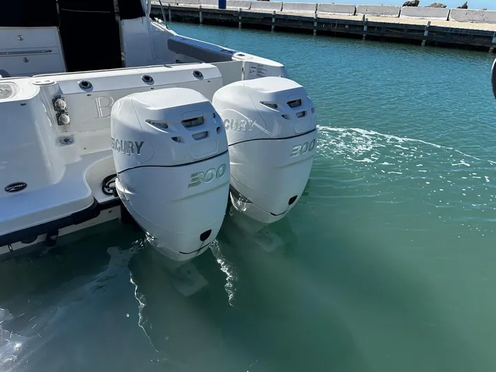  Yacht Photos Pics Twin outboard engines on a 2015 Boston Whaler 315 Conquest in clear water.